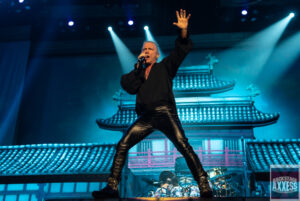 Singer with Gene Simmons on the stage for a performance