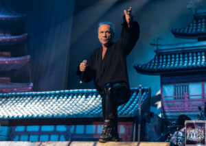 The singer poses for the fan while singing