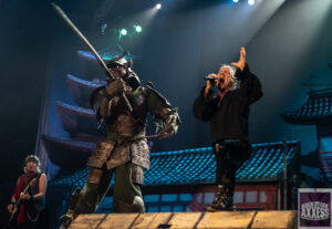 The backstage Axxess star singing with the warrior on stage
