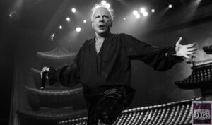 Black and white picture of singer performing on stage