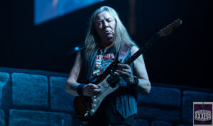 Adam Duce performing with his guitar