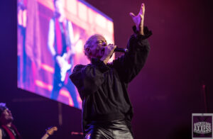 The singer poses for the fan while singing